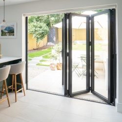 A clean, white space with bi-folding doors partially open